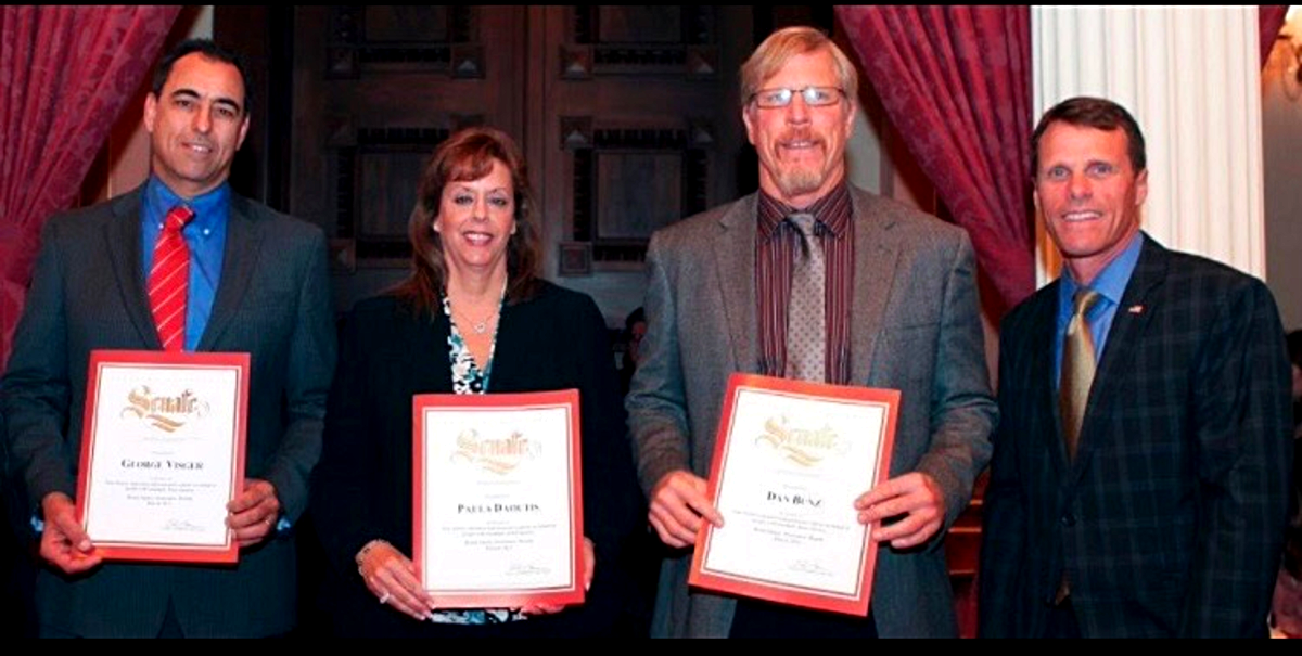 Paula Daoutis receiving a California Senate recognition